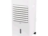 a white air conditioner sitting on top of a white table