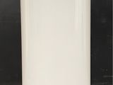 an image of a white water heater sitting on the floor