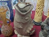 many different vases that are on a red table