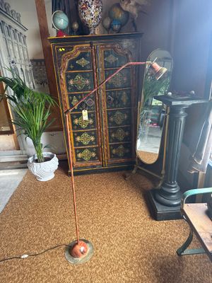 a lamp that is on a stand in a room
