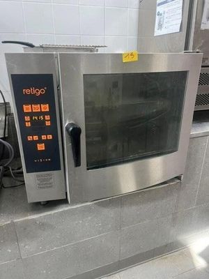 a silver microwave sitting on a counter in a kitchen