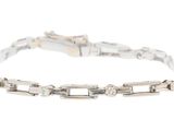 a white gold bracelet with diamonds and a clasp