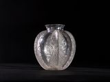 a glass vase that is sitting on a table