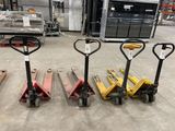 several forklifts are lined up in a row in a warehouse
