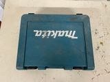 an old blue tool box sitting on top of a table