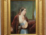 tableau représentant une femme tenant un panier à la main, dans un cadre doré