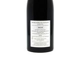 a bottle of wine that is sitting on a table
