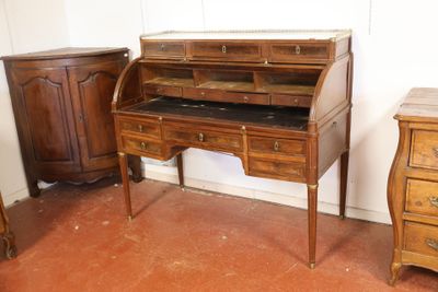 a small desk with a marble top in a room