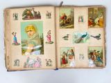 an open book with pictures of people and animals on it