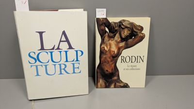two books sitting on a table next to each other on a table