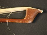 a close up of a wooden bow with a string attached to it