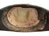 a close up of a hat with a hole in it