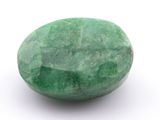 an image of a green stone on a white surface