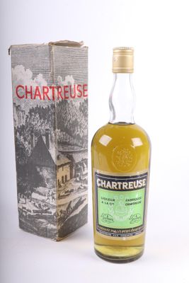 a bottle of chartreuse whisky next to a box