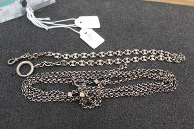 two silver chains with a silver clasp and a silver chain with a silver clasp and a silver chain with a silver clasp and a silver chain with a silver clasp