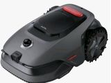a close up of a robotic lawn mower on a white background