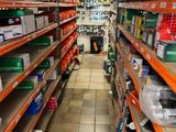 many shelves in the store that have various items on them