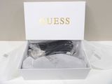 the box is open with a pair of shoes in it