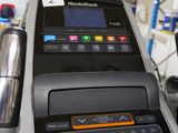 a close up view of a tread machine in a gym