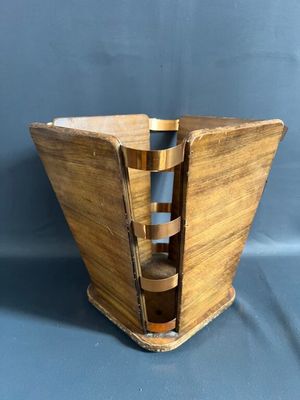 a wooden magazine holder with a magazine in it