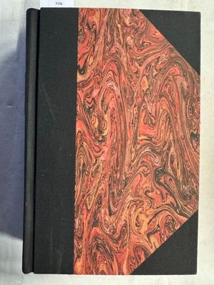 une image représentant un livre à la couverture rouge et noire
