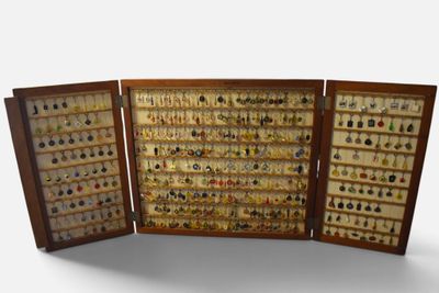 a close up of a display case filled with lots of different types of earrings