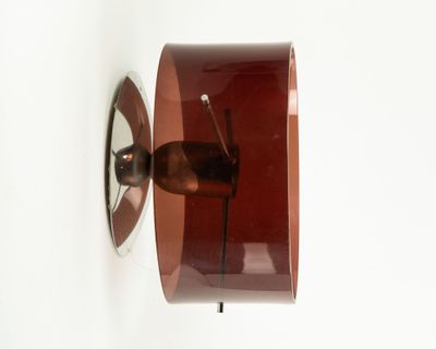 an image of a wall mounted clock on a white wall