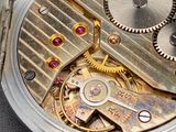 a close up of a pocket watch with a metal case