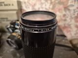 a camera lens sitting on top of a cup on a table