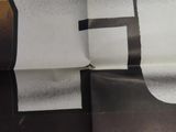 an image of a close up of a piece of paper with a black and white design