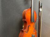 an old violin hanging on a wall next to a violin