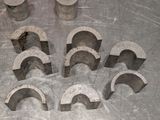 several pieces of concrete are arranged in a circle on a metal surface