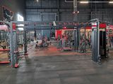 a large gym with a lot of machines in it