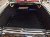 a trunk of a car with a book in it