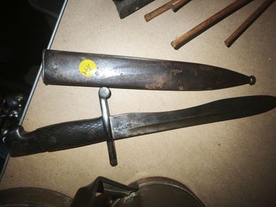 two knives that are sitting on a table