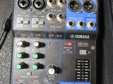 a close up of a mixer with many knobs on it