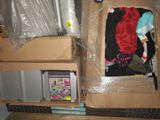 a cardboard box that has some clothes inside of it