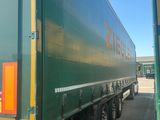 a semi truck that is parked in a parking lot