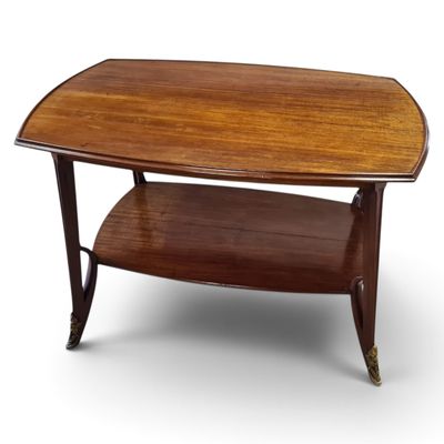 a wooden coffee table with a shelf on top of it
