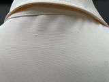 a close up of a white shirt with a collar