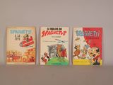 three children ' s books are lined up on a white surface