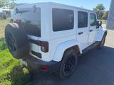 a picture of a white jeep parked on the side of the road