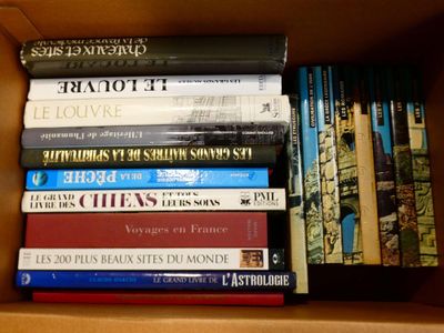 a box full of books that are sitting on top of each other