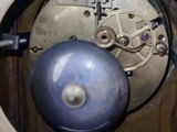 a clock with a blue ball in the middle of it