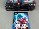 three packs of dragon ball trading cards sitting on top of a table