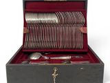 a box with a bunch of forks and spoons in it