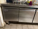 a stainless steel dishwasher sitting in a kitchen