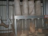 a bunch of bags that are sitting on a rack