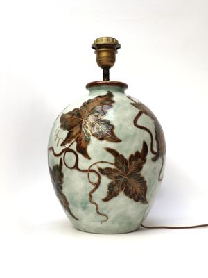 an image of a vase with a lamp on top of it