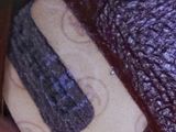 a close up of a stuffed animal with a piece of fabric on it